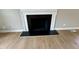 Close-up of a fireplace and hardwood floors at 3804 Cobb St, Garner, NC 27529