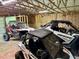 Unfinished garage featuring multiple off-road vehicles at 3804 Cobb St, Garner, NC 27529