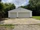 Exterior of detached two-car garage with white siding and concrete driveway at 3804 Cobb St, Garner, NC 27529