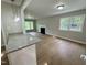 Open living room with fireplace and hardwood floors at 3804 Cobb St, Garner, NC 27529
