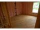 New construction bedroom with stud walls, insulation, and a window ready for finishing touches at 4109 Stonewall Dr, Raleigh, NC 27604