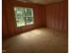 New construction bedroom with stud walls, insulation, and a large window allowing ample light at 4109 Stonewall Dr, Raleigh, NC 27604