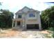 New home featuring an attached garage and a covered front entrance at 4109 Stonewall Dr, Raleigh, NC 27604