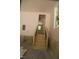 Garage with wooden stairs leading to the main floor and natural light at 4109 Stonewall Dr, Raleigh, NC 27604