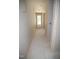 Bright hallway with a door leading outside, ready for finishing touches at 4109 Stonewall Dr, Raleigh, NC 27604