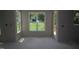 Bright living room with large windows and a door leading to the backyard deck, ready for personalization at 4109 Stonewall Dr, Raleigh, NC 27604
