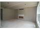 Spacious living room featuring a fireplace, bright windows, and drywall ready for finishing touches at 4109 Stonewall Dr, Raleigh, NC 27604