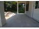 Covered front porch with stylish tile flooring and elegant support columns, perfect for outdoor relaxation at 4109 Stonewall Dr, Raleigh, NC 27604