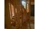 New construction staircase leading to the upper level, framed for finishing and customization at 4109 Stonewall Dr, Raleigh, NC 27604