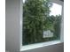 A window offers a view of lush greenery in a new construction at 4109 Stonewall Dr, Raleigh, NC 27604