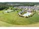 Community amenities include a pool, clubhouse, tennis court and green space, and more at 42 Village Walk Dr, Chapel Hill, NC 27517