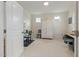 Bright bedroom featuring neutral walls, carpet, closet, and two windows for natural light at 42 Village Walk Dr, Chapel Hill, NC 27517