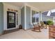 Inviting front porch with rocking chairs, creating a cozy and welcoming entrance to the home at 42 Village Walk Dr, Chapel Hill, NC 27517