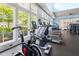 Well-equipped gym with large windows, treadmills, and various exercise machines at 42 Village Walk Dr, Chapel Hill, NC 27517