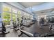 Fitness center with diverse workout equipment and large windows offering natural light at 42 Village Walk Dr, Chapel Hill, NC 27517