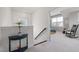 Hallway showcases a small table and staircase, leading to the bedrooms and living areas at 42 Village Walk Dr, Chapel Hill, NC 27517