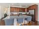 Well-equipped kitchen features an island with bar seating, stainless appliances, and granite countertops at 42 Village Walk Dr, Chapel Hill, NC 27517