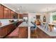 Spacious kitchen with island seating, stainless steel appliances, and hardwood flooring at 42 Village Walk Dr, Chapel Hill, NC 27517