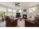 Cozy living room featuring a fireplace, hardwood floors, and natural light at 42 Village Walk Dr, Chapel Hill, NC 27517