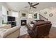 Comfortable living room with a fireplace, hardwood flooring, and staircase at 42 Village Walk Dr, Chapel Hill, NC 27517