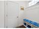 Mud room with beadboard, coat hooks, storage bench, and doorway to the exterior at 42 Village Walk Dr, Chapel Hill, NC 27517
