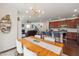 Bright open concept boasts an eat in kitchen, living area and staircase in a seamless transition at 42 Village Walk Dr, Chapel Hill, NC 27517
