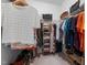 Spacious walk-in closet features organized shelving, hanging racks, and ample storage for clothes and accessories at 42 Village Walk Dr, Chapel Hill, NC 27517