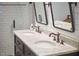 Elegant bathroom featuring a marble top double sink vanity and vintage-style fixtures at 423 N Cameron St, Hillsborough, NC 27278