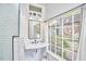 Bright bathroom with subway tile and a large window at 423 N Cameron St, Hillsborough, NC 27278