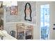 A corner of a dining room with wallpaper, bamboo cart, and access to a patio at 423 N Cameron St, Hillsborough, NC 27278