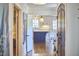 Open view of the kitchen, showcasing modern appliances and an island with barstool seating at 423 N Cameron St, Hillsborough, NC 27278