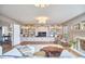 Spacious living room showcasing built-in shelving, fireplace, and hardwood floors at 423 N Cameron St, Hillsborough, NC 27278