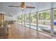 Charming screened porch with ceiling fan, outdoor seating overlooking the beautiful pool and backyard at 423 N Cameron St, Hillsborough, NC 27278