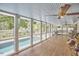 Relaxing screened porch with a view of the sparkling pool and lush, private backyard at 423 N Cameron St, Hillsborough, NC 27278