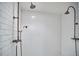 Bathroom shower with white subway tile and vintage-style fixtures at 423 N Cameron St, Hillsborough, NC 27278