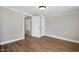 Bedroom with wood floors and neutral wall color at 441 Cedar St, Henderson, NC 27536
