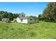 Exterior view of a home with a grassy yard and a truck, under a clear blue sky at 441 Cedar St, Henderson, NC 27536