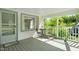 Charming front porch with a small table, chairs, and a 'Welcome' mat at 441 Cedar St, Henderson, NC 27536