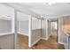 Bright living room with wood floors that leads to the kitchen at 441 Cedar St, Henderson, NC 27536