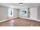 Cozy living room featuring wood floors, natural light, and a white door at 441 Cedar St, Henderson, NC 27536