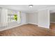 Bright room with wood floors, white trim, and a front door entrance at 441 Cedar St, Henderson, NC 27536