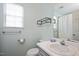 Updated bathroom with modern fixtures, a sink, and ample natural light at 4520 Timberhurst Dr, Raleigh, NC 27612