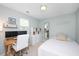 Bright bedroom with a workspace, storage, and a comfortable single bed at 4520 Timberhurst Dr, Raleigh, NC 27612