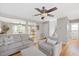 Cozy living room with hardwood floors, an open layout, comfortable seating, and view to dining area at 4520 Timberhurst Dr, Raleigh, NC 27612