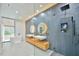 Spacious bathroom with dual vanities, soaking tub, and a marble shower with rain shower head at 4908 Birchleaf Dr, Raleigh, NC 27606
