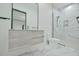 Modern bathroom with marble floors, a sleek vanity, and a frameless glass shower enclosure at 4908 Birchleaf Dr, Raleigh, NC 27606
