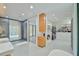 Large luxurious bathroom featuring dual vanity, soaking tub, shower, and closet at 4908 Birchleaf Dr, Raleigh, NC 27606