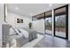 Sunlit bedroom boasts stylish decor, a plush bed, and a large window offering serene outdoor views at 4908 Birchleaf Dr, Raleigh, NC 27606