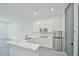 Modern kitchen featuring sleek white cabinetry, stainless steel appliances, and a stylish island at 4908 Birchleaf Dr, Raleigh, NC 27606