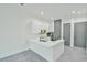 Modern kitchen featuring sleek white cabinetry, stainless steel appliances, and a stylish island at 4908 Birchleaf Dr, Raleigh, NC 27606